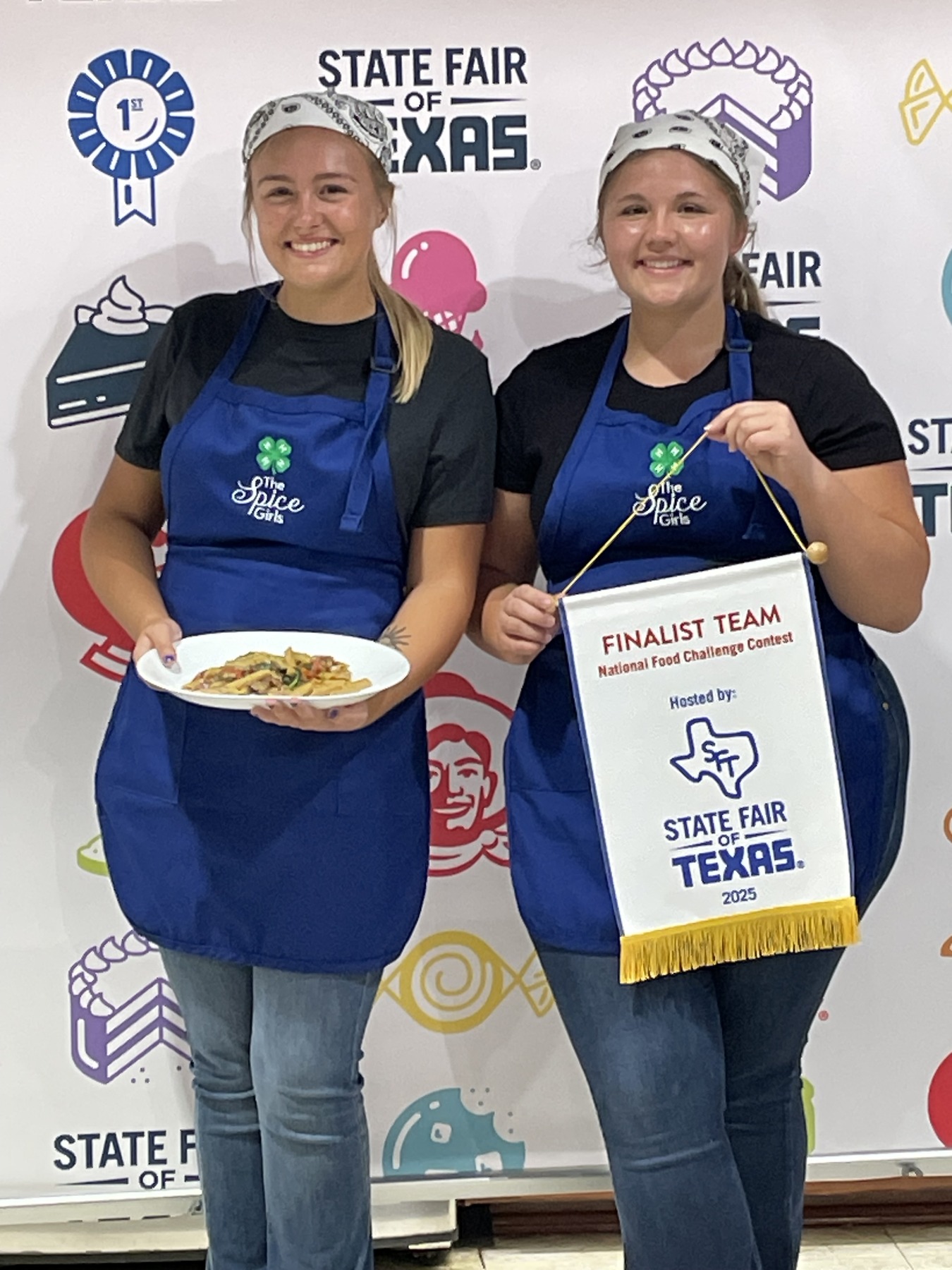 Senior Team holding a Finalist Team banner at the National Food Challenge, State Fair of Texas 2025